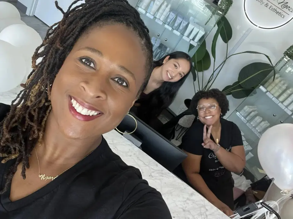 Crystal Ngozi Beauty & Esthetics team at the reception counter, Tucker