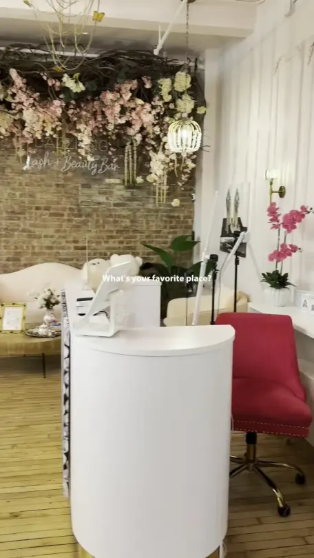 Lounge area with Dazzling Lash + Beauty Bar neon sign, Alpharetta