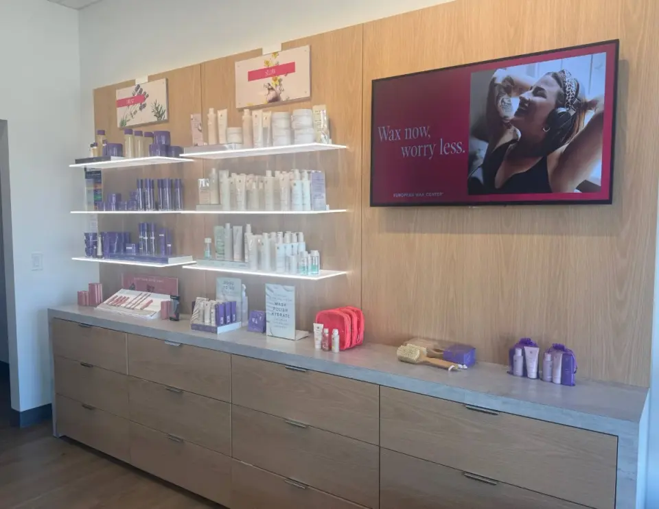 Retail display wall at European Wax Center, Hialeah Country Club Plaza