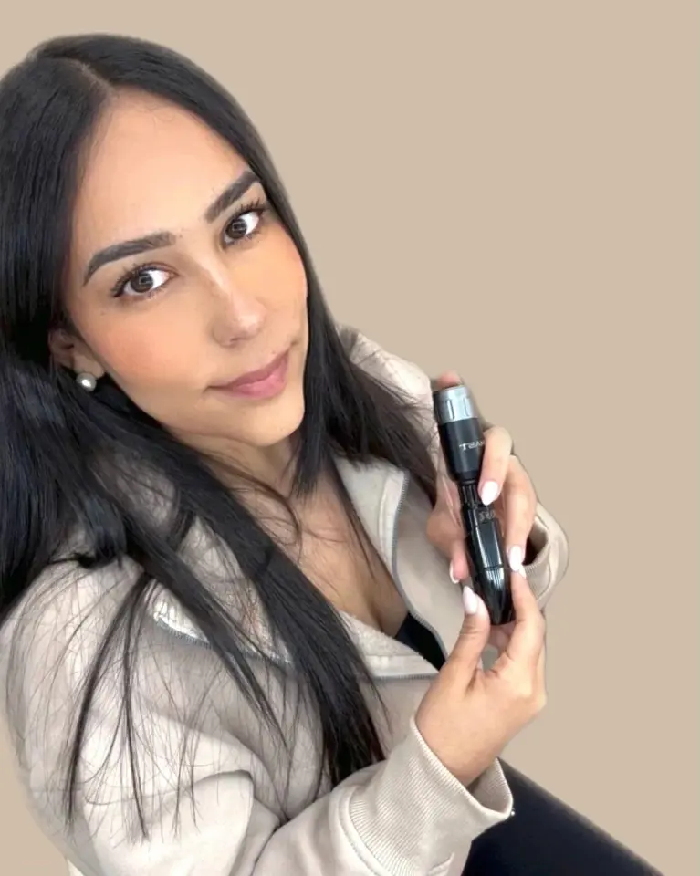 KBELLA Studio esthetician with a PMU device