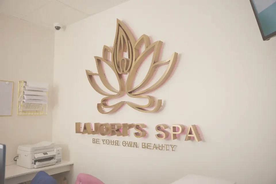 Gold lotus wall sign inside Lajori's Beauty Bar & Spa, Stockbridge