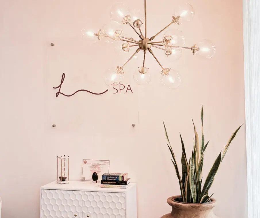 Reception area with Lau Spa wall sign, Coral Springs