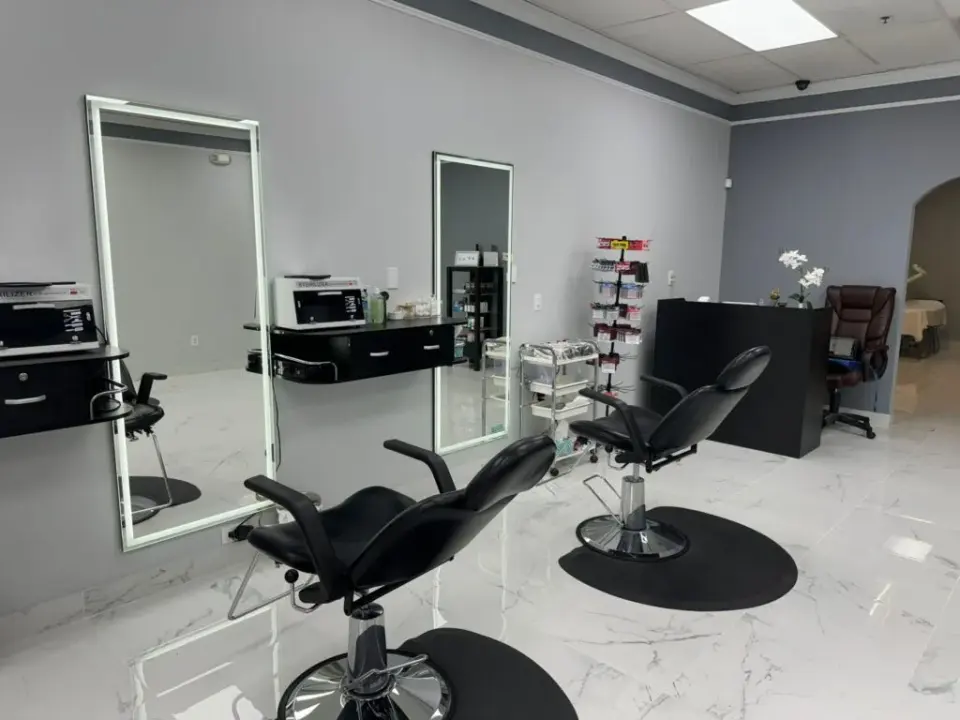 Treatment chairs and styling stations inside Looking Like a WOW Threading & Waxing, Snellville