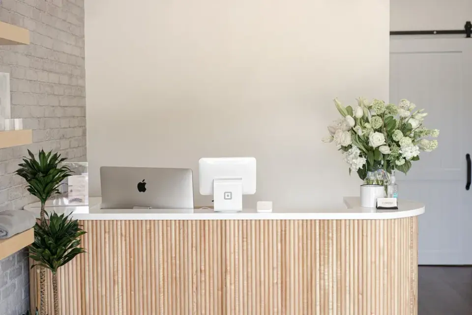 Reception desk at Lumière Lash Atlanta