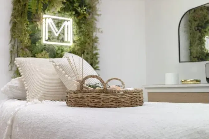 Treatment bed with aftercare basket at Michella Minotti, Pembroke Pines