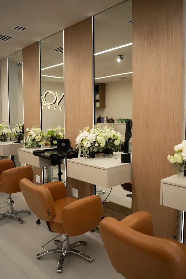Styling stations with branded wall at NOA Beauty, Surfside