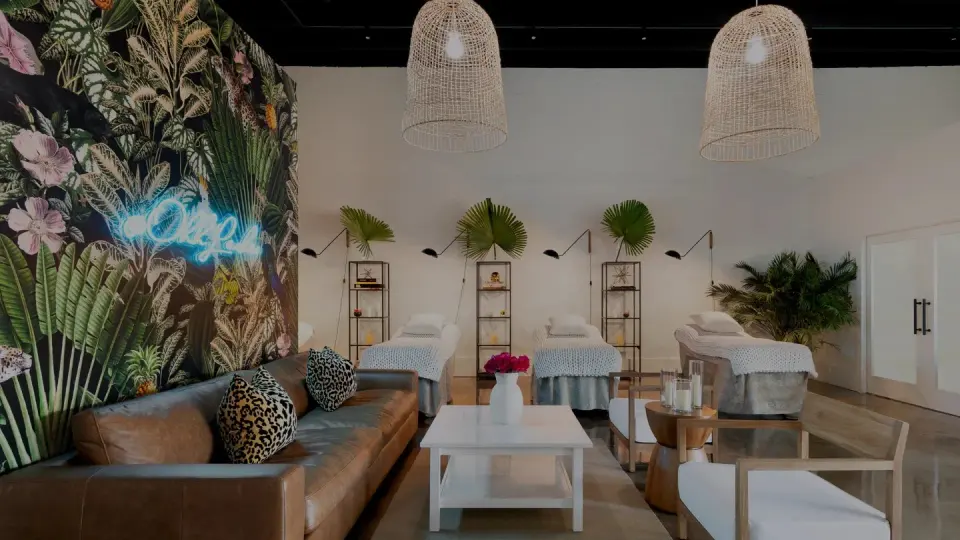 Lounge seating with neon Ohh! Lashes sign in the studio