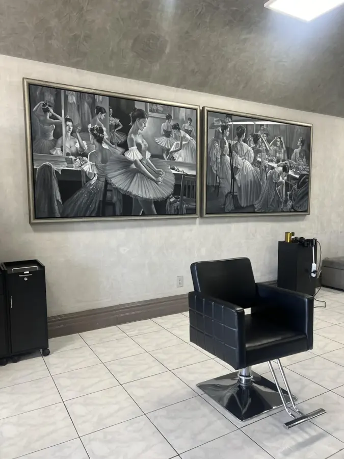 Salon chair and wall photographs at Rozina’s Beauty Spa
