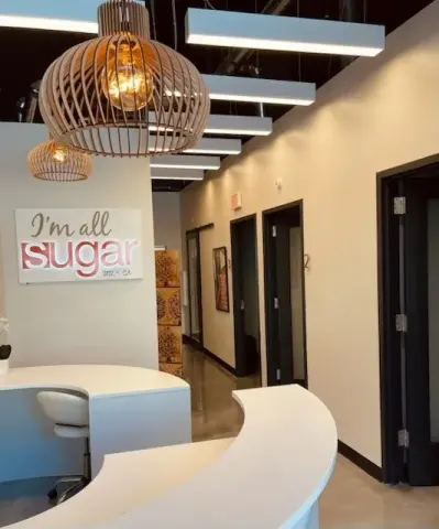 Reception and treatment-room corridor at Sugar Sugar Downtown LA