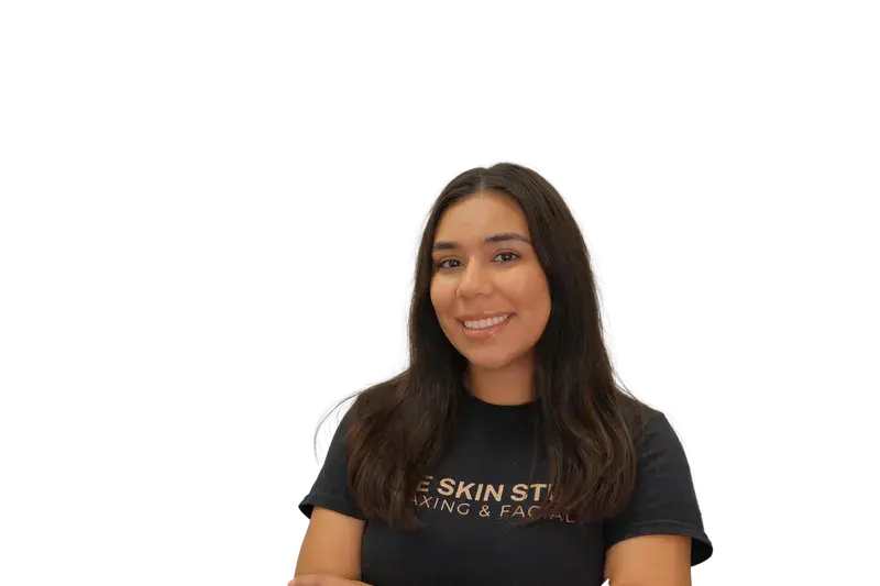 Esthetician in branded True Skin Studio shirt