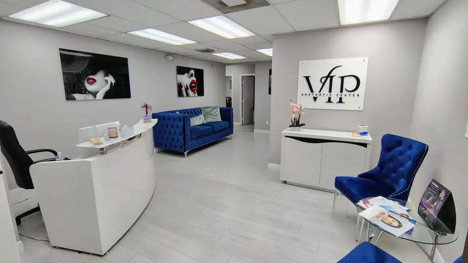 Reception area with VIP Aesthetic Center wall sign, Hallandale Beach