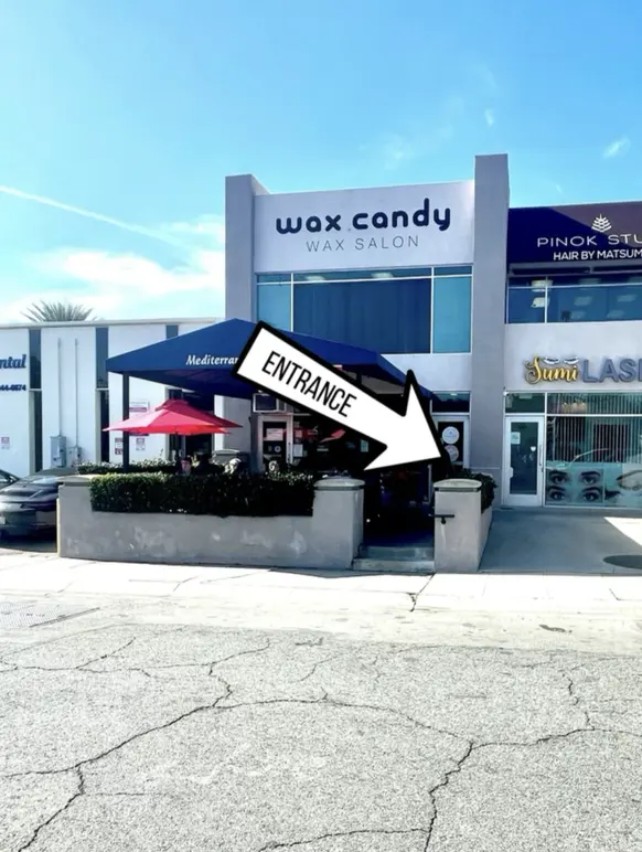 Wax Candy Pasadena storefront with the studio’s entrance arrow annotation