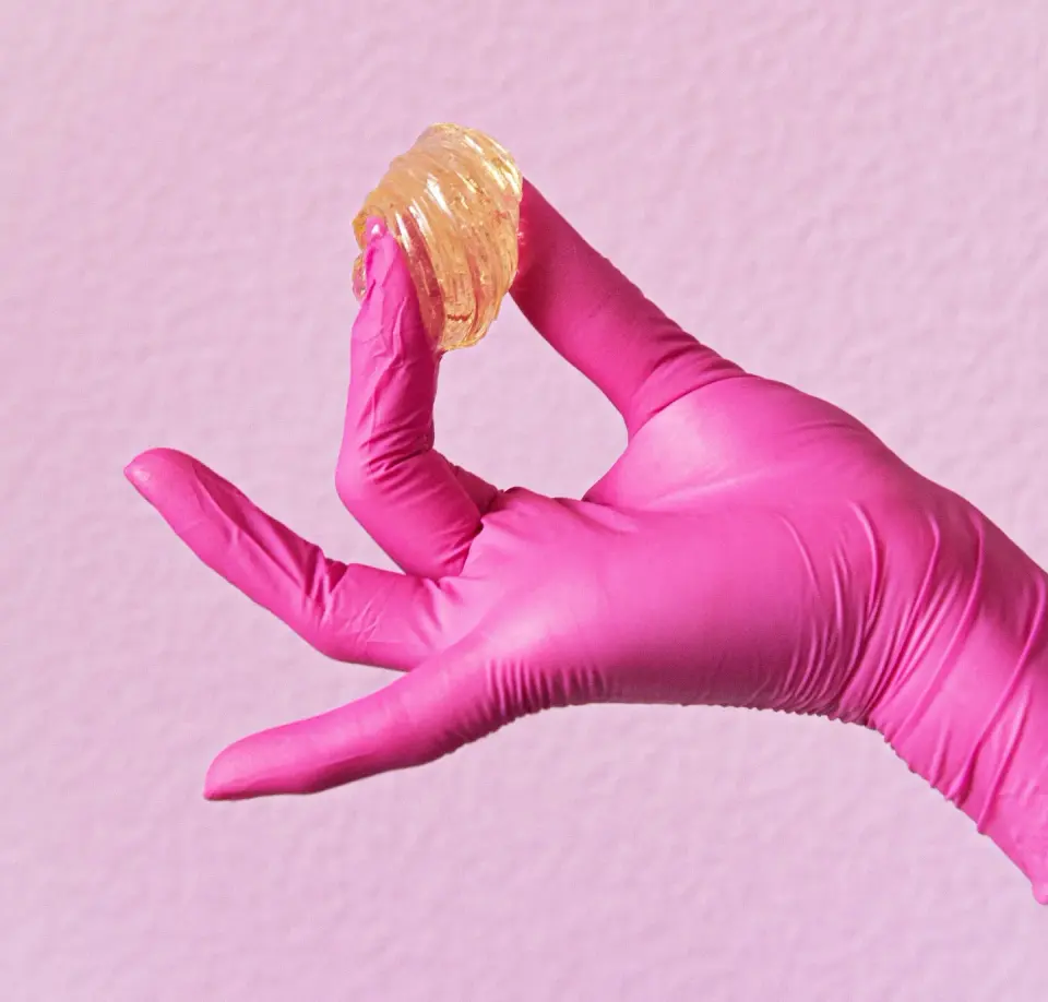Sugar wax on a gloved hand, branded service shot for Xo Rituals
